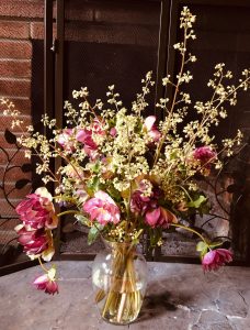 Cream-colored heuchera flower spikes fill out this Lenten Rose bouquet